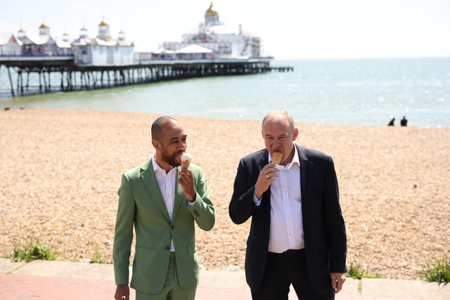 EASTBOURNE, ENGLAND - MAY 24: Liberal Democrat leader Ed Davey with Liberal Democrat candidate Josh Babarinde enjoy an ice cream during a visit to the marginal seat of Eastbourne on May 24, 2024 in Eastbourne, England. The Liberal Democrats are targeting Conservative marginal seats along the South Coast in the upcoming general election on July 4th.  (Photo by Dan Kitwood/Getty Images)