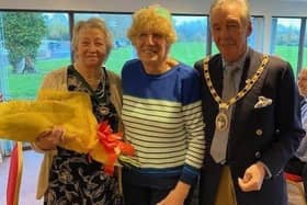 Hailsham volunteer, Gerry Constable (centre), has been awarded a British Empire Medal in the King’s New Year Honours for Services to the Community in Hailsham and Eastbourne.