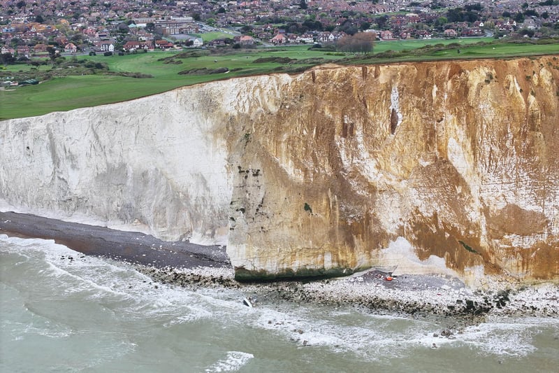 Photos show a grounded yacht in the water at Seaford Head on Friday, April 19
