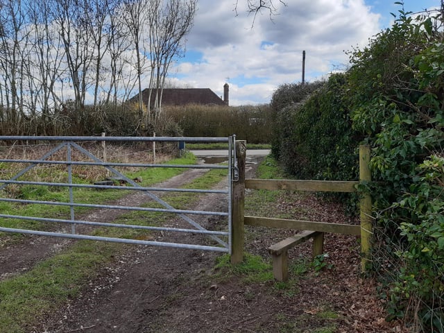 You can use the stile or gate to exit to reach Fryern Road. Turn right and not far along you find the bus stops.