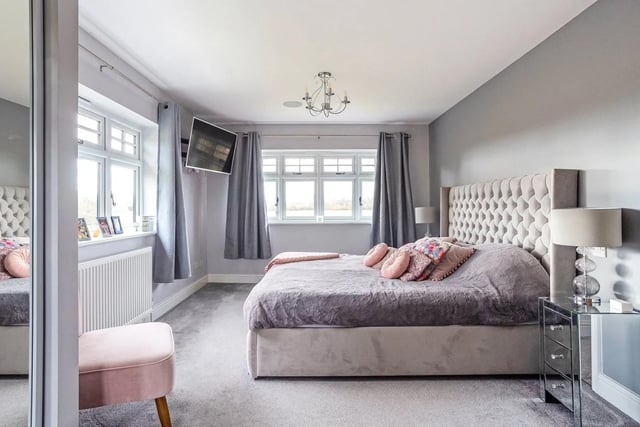 The first floor provides five bedrooms. The principal suite occupies the southern end with a walk-through dressing area and an ensuite shower room