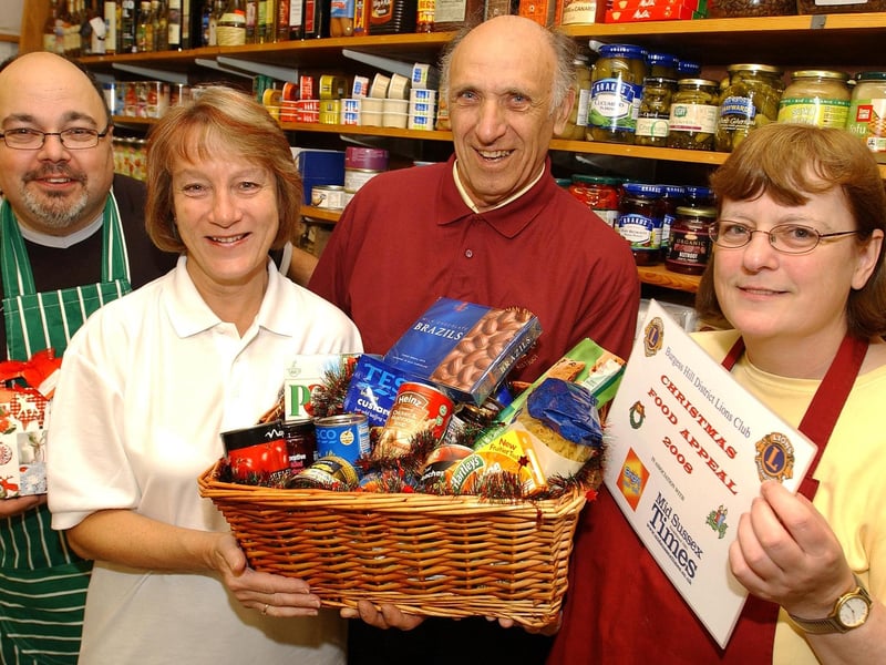 Burgess Hill district Lions Club launched its appeal for Christmas food hampers to help pensioners and families on low incomes. Pictured are Pete and Jackie Skolimowski of Downsview Deli, Keymer Road (right and left), with Burgess Hill district Lions Diane Cubitt and Norman Evenden