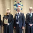 University of Chichester law students celebrate their win in the new Moot Room with Lord Briggs