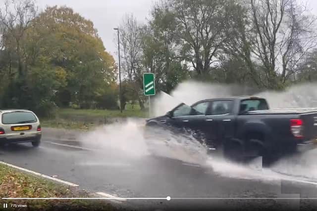 Heavy rain has caused flooding and sewage to spill on the A24 between Ashington and Findon.