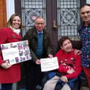 Ashley Price, president of Lewes Chamber of Commerce, presents a cheque to Bevern Trust resident JP, accompanied by Dionne and Maciek