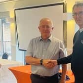 Bernie Watson, left, receiving his prize from Alex Henderson, Captain of Cottesmore Seniors