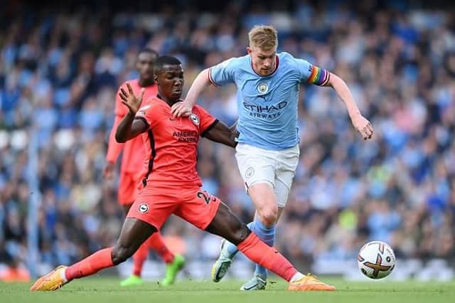 Moises Caicedo of Brighton tackles Kevin De Bruyne of Manchester City during Albion's Premier League loss