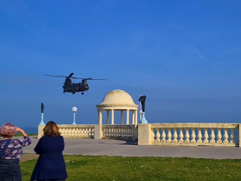 A Boeing Chinook helicopter pictured over the Bexhill De La Warr Pavilion domes