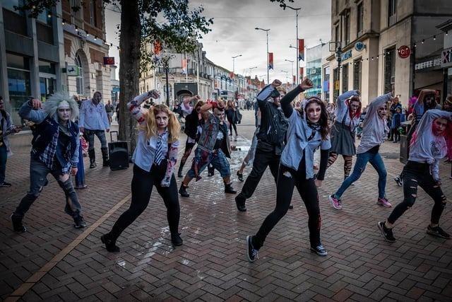 A zombie flash mob took to the streets in 2021.
