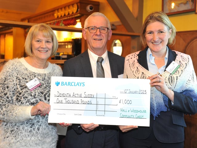 Dementia Active Sussex with judge Susie Rees, right, receiving £1,000 for the services of a qualified fitness instructor