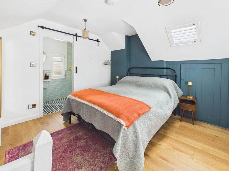 The well-proportioned double bedroom benefits from integrated storage