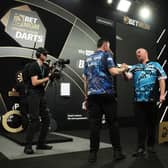 Rob Cross was victorious in a dramatic match over Premier League leader Luke Humphries in a dramatic quarter final match in Brighton – which saw an astonishing nine darter. Photo: PDC / Kieran Cleeves