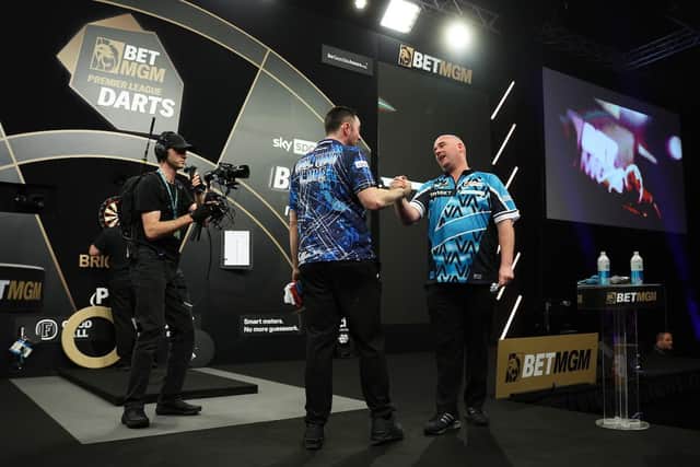 Rob Cross was victorious in a dramatic match over Premier League leader Luke Humphries in a dramatic quarter final match in Brighton – which saw an astonishing nine darter. Photo: PDC / Kieran Cleeves