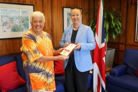 Pauline being presented with  the British High Commissioner in Malawi, Sophia Willitts-King.
