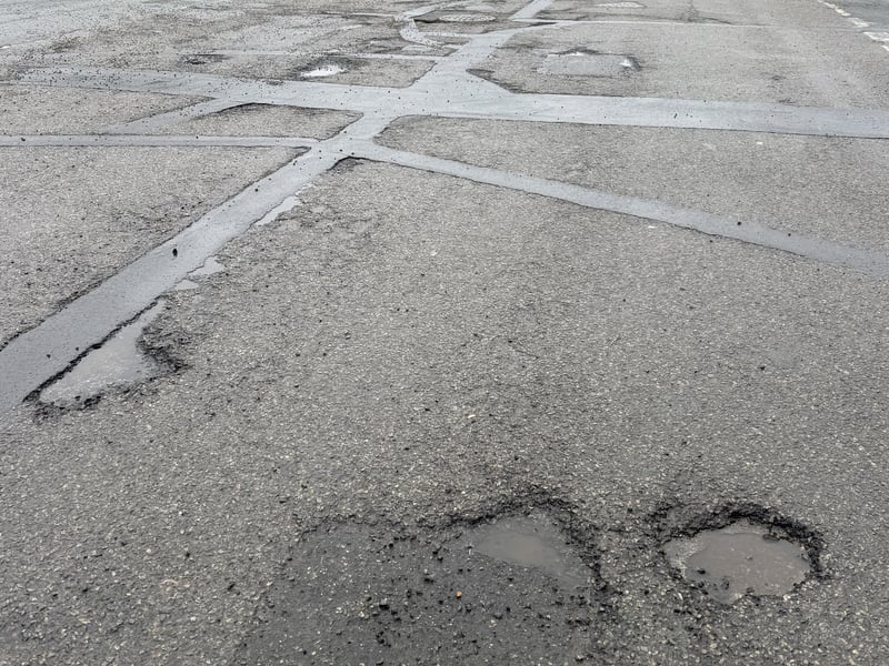 Orchard Road is strewn with potholes
