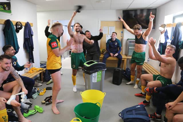 The post-match celebrations in the Horsham dressing room following their shock FA Cup win over National League outfit Dorking Wanderers. Picture by John Lines