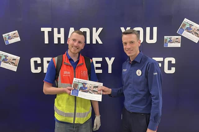 Tesco customer delivery driver Ross Youngman being presented with a 'Tesco Values Award' by delivery team manager Gavin Lawrence
