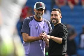 Liverpool's German manager Jurgen Klopp (L) will welcome Brighton to Anfield tomorrow for a Sunday Premier League clash
