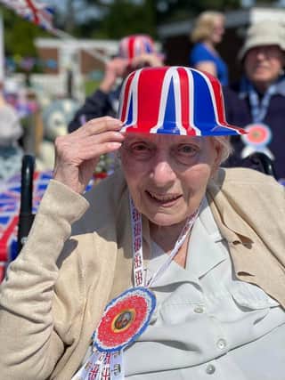 One of our lovely residents enjoying the festivities at the Coronation Tea party. 