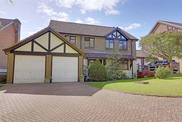 This five-bed detached house features a reception hall, lounge, dining room, family room, open plan kitchen/dining room and utility room. Outside there is a private driveway, double garage, front garden and a west-facing rear garden backing onto farmland. It is on the market with Bacon and Company with a guide price of £830,000.