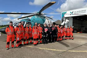 Doctors, paramedics and pilots from KSS celebrating the success of the appeal to buy the helicopter