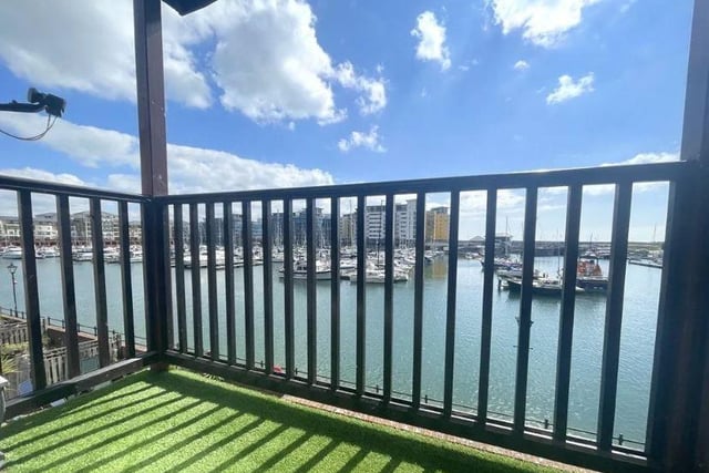 The views over the harbour can be seen from the apartment's decked balcony