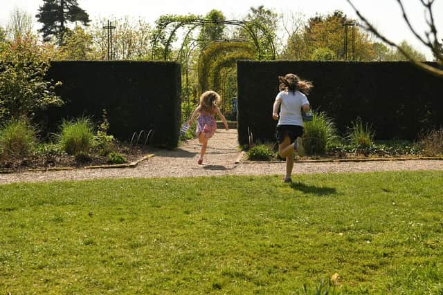 Children enjoying the gardens at Nymans, West Sussex