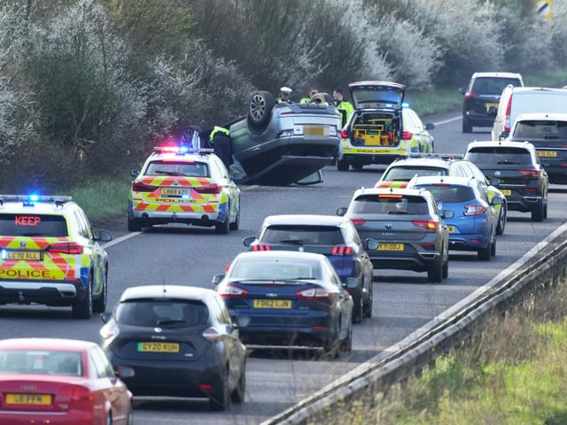 A woman has been arrested on suspicion of ‘driving while under the influence of alcohol and driving without a licence’ after overturning a vehicle on a major Sussex road.