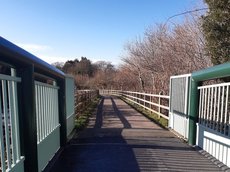 As you come down the other side, you will see a small car park below to the left.