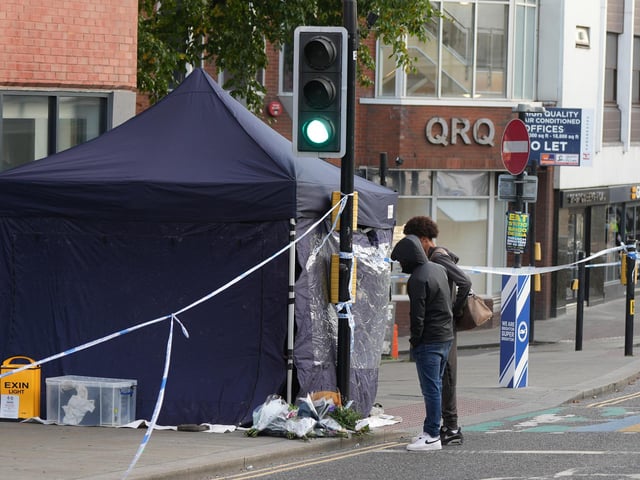 Friends gather at the scene
