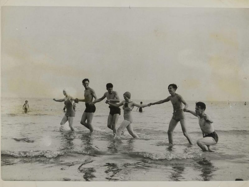 With the lifting of the coast ban, seaside resorts saw a big turn-out of tourists. The photograph shows bathers at Bognor Regis.