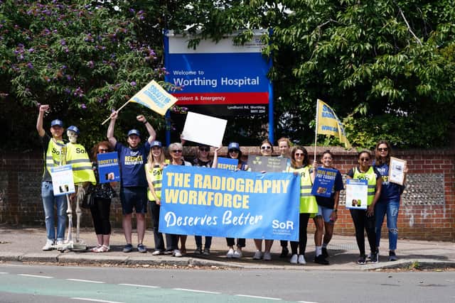 Up to 25 people were on the picket line outside Worthing Hospital – with equates to 80 per cent of the department. Photo: Eddie Mitchell