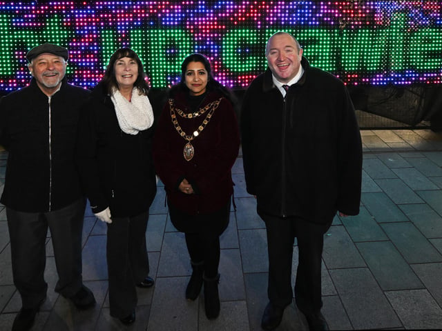 Crawley Borough Councillors Sharmila Sivarajah, Michael Jones, Chris and Sue Mullins. 'The Hexagons’, a custom-made wall of LED neon hexagons each with its own button to turn it on, off and change the colour. Gavin Morris created the dazzling interactive light installation as part of the Digital Funfair to encourage collaborative play and control of the urban environment.