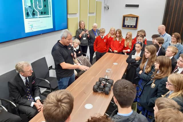 Peter Karmios shows students the kind of vehicle they will be making for the Mid Sussex STEM challenge 2022