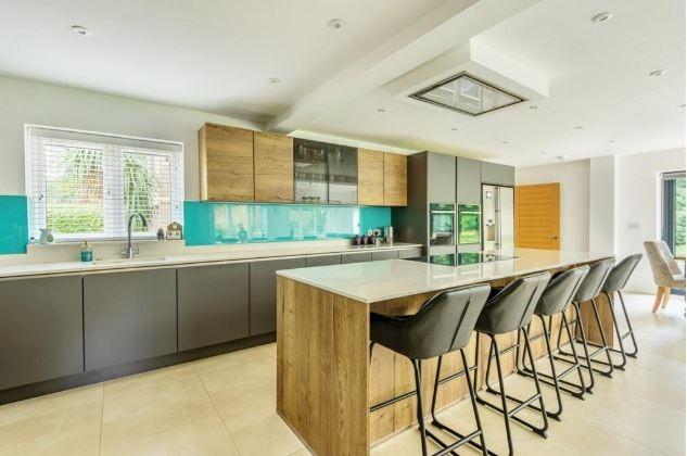 The kitchen features a selection of quality cabinets with contrasting tones and Quartz worksurfaces. There is a selection of high end integrated appliances including coffee machine, wine fridge, ovens, induction hob and an integrated dishwasher as well as cleverly designed LED lighting.