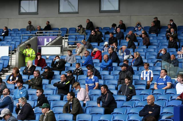 BRIGHTON, ENGLAND - AUGUST 29: Fans in the stands watch the match as part of a pilot event following the coronavirus pandemic during the pre-season friendly between Brighton & Hove Albion and Chelsea at Amex Stadium on August 29, 2020 in Brighton, England. (Photo by Steve Bardens/Getty Images)