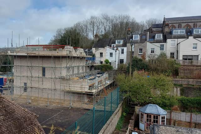 Lewes District Council’s planning committee approved plans to build three houses to the rear of a Grade II listed building in the town