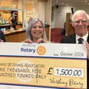 Worthing Rotary Club president John Fozard presents the cheque to Worthing Veterans Association vice-chairman Sid Hunt and Melanie Peters