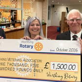 Worthing Rotary Club president John Fozard presents the cheque to Worthing Veterans Association vice-chairman Sid Hunt and Melanie Peters