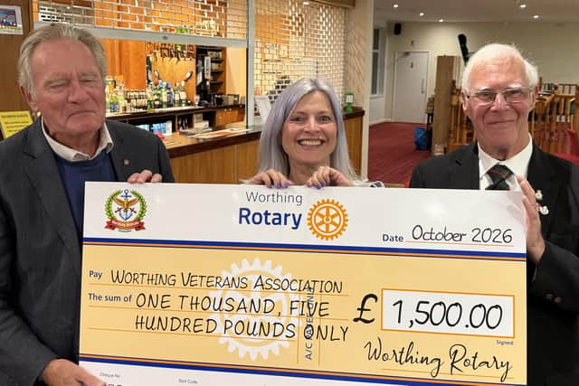 Worthing Rotary Club president John Fozard presents the cheque to Worthing Veterans Association vice-chairman Sid Hunt and Melanie Peters