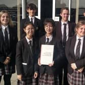 St Catherine's College students with the climate change report