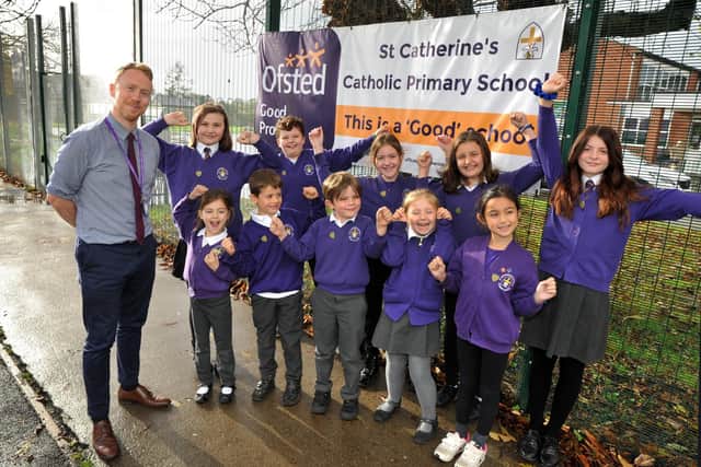 Head teacher Derek Croghan and pupils at St Catherine's Catholic Primary School, Littlehampton, celebrate their recent good Ofsted inspection. Pic S Robards SR2211161
