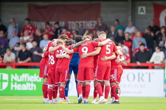 Crawley Town players get in a huddle before Saturday's game with Gillingham at the Broadfield Stadium. Picture: Eva Gilbert