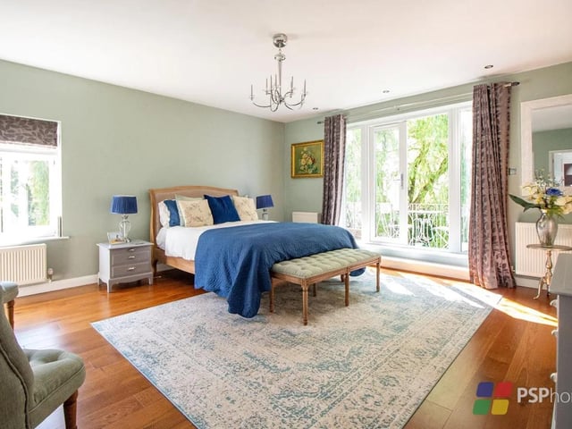 The main bedroom has double doors that open on to the balcony