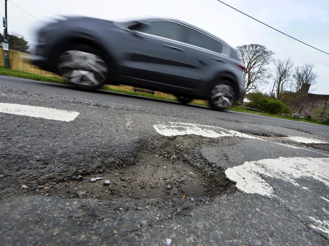 Potholes in Jevington Road, Polegate (Photo by Jon Rigby)