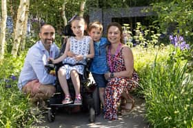 Josie Chubb, aged 7 from Lewes, along with her family at the ‘Muscular Dystrophy UK – Forest Bathing Garden’ designed by Ula Maria at the RHS Chelsea Flower Show's press day. Image: Rebekah Kennington