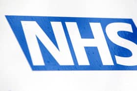 NHS logo, photo from Yui Mok/ PA Wire/PA Images