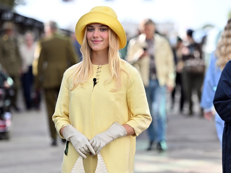 Race meet goers in vintage fashion at day one of the Goodwood Revival at the Goodwood Motor Circuit in Chichester, West Sussex.