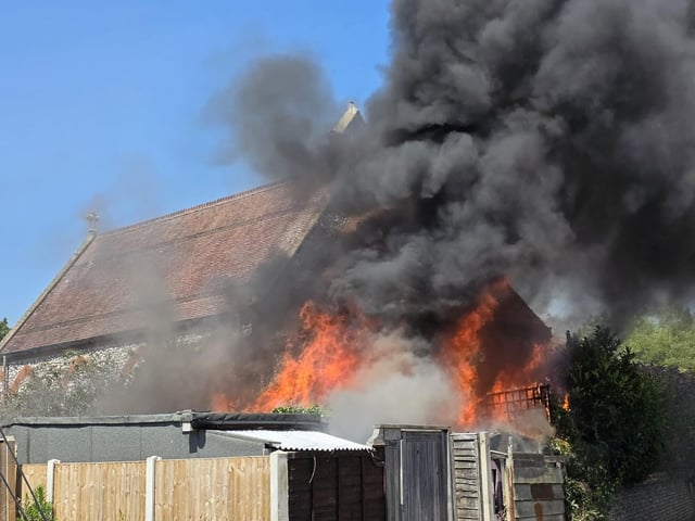 Firefighters tackle a blaze that destroyed two sheds, on Beaconsfield Road