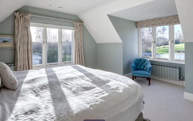 One of the property's double bedrooms with views across the gardens